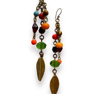 Brass bohemian dangle beaded earrings with an emerald stone.